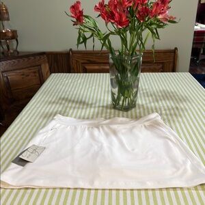 Women's Skort. Athletic/Golf white with pockets.